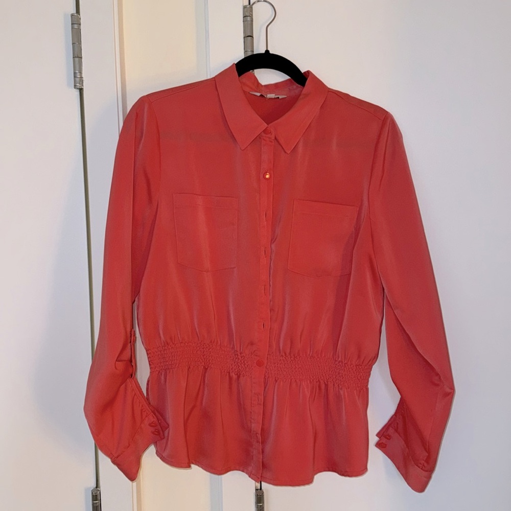 Pink blouse.